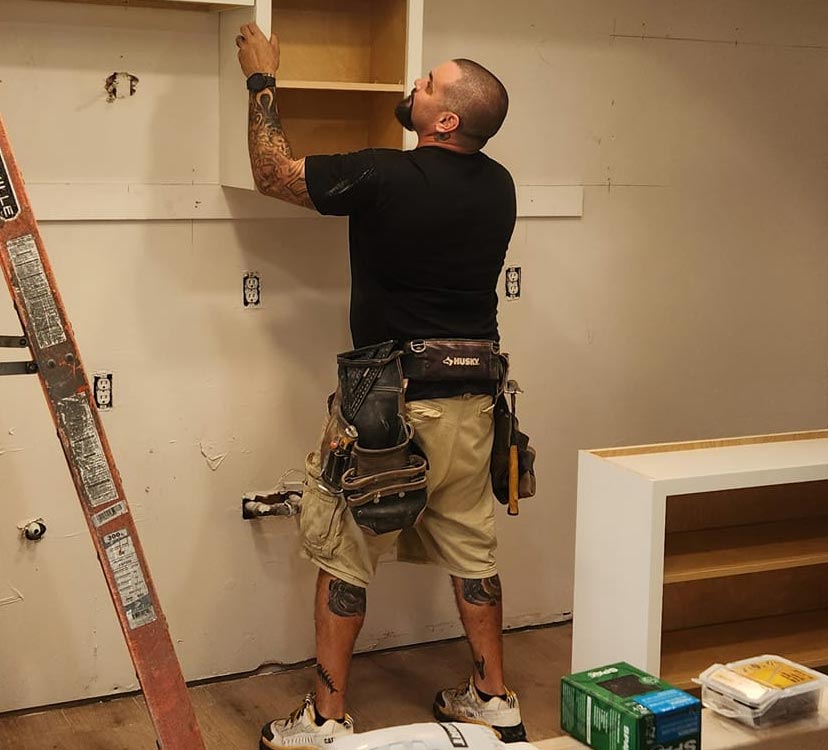 Charles Niessen, founder of Niessen Construction, with construction team at Bastrop County job site